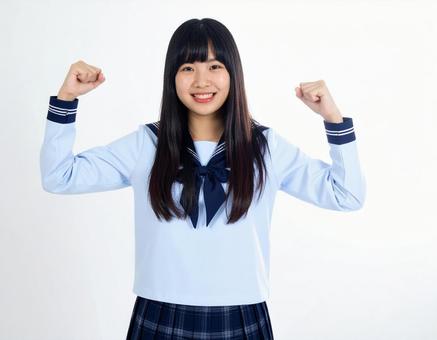 ガッツポーズをする女子生徒のイメージ ガッツポーズをする女子生徒のイメージの写真