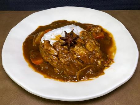 Chicken wing curry made with frozen rice, curry, spices, star anise, JPG