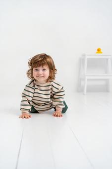 A baby with a striped pattern crawling happily, JPG
