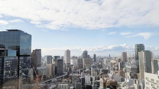 都会のビルから眺めた大阪のビル街 ビル,高層ビル,空の写真素材