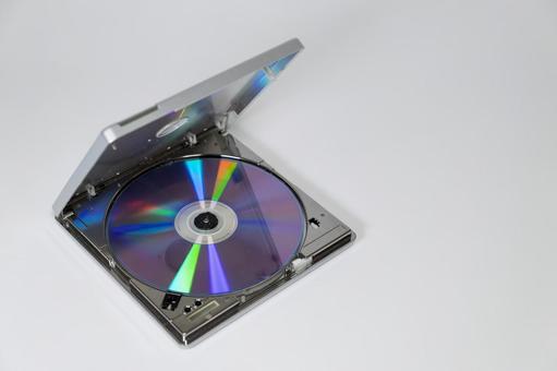 ポータブルCDドライブとセットされたCD cd,コンパクトディスク,プレーヤーの写真素材
