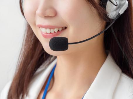 Image of a female operator wearing a headset, مركز الاتصال, عامل, سماعة, JPG