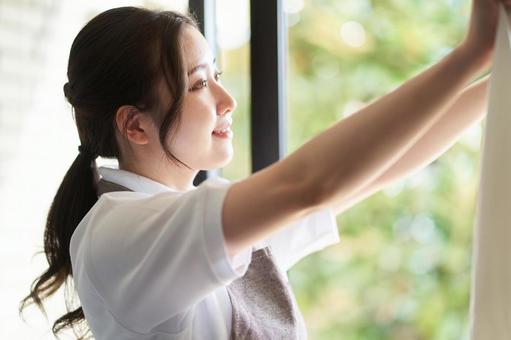 Asian woman hanging laundry by the window, JPG Asian woman hanging laundry by the window, laundry, washing, female, JPG