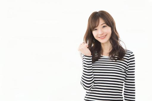 若い女性 ガッツポーズ 若い女性 ガッツポーズの写真