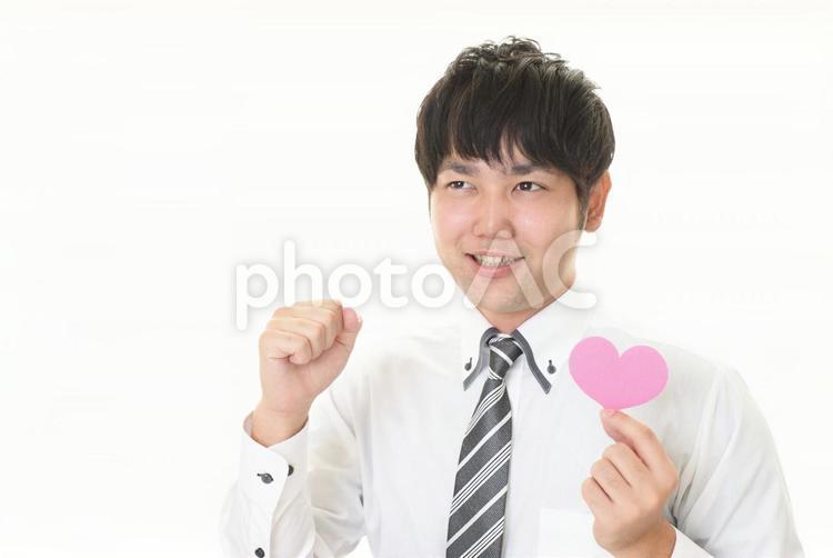ハートマークを持つ男性 ビジネス,ビジネスマン,男性の写真素材