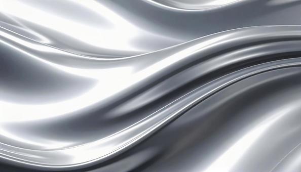 光を反射する銀色の曲線パターンの写真