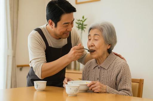 高齢の母親に食事を介助 高齢の母親に食事を介助の写真