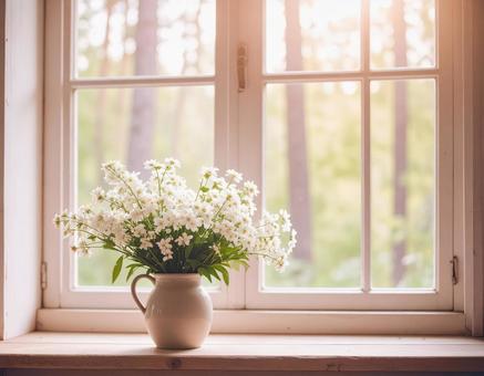 窓辺の花瓶に入った白い花2 窓辺の花瓶に入った白い花2の写真