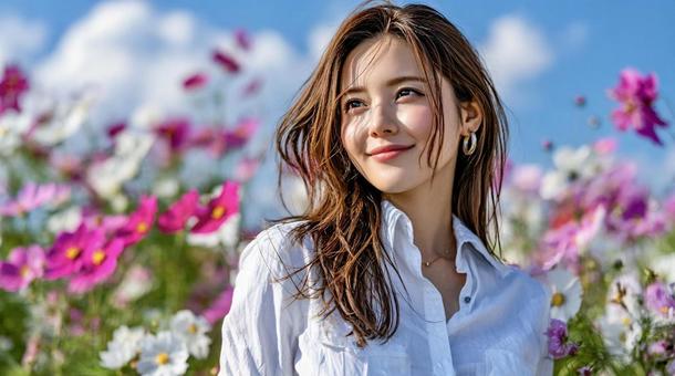 コスモス畑で微笑む女性の秋ポートレート コスモス畑で微笑む女性の秋ポートレートの写真