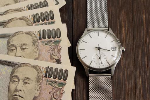 時計と一万円札のイメージ 時計,一万円札,日本円の写真素材