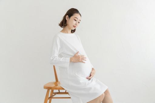 Pregnant woman touching her tummy, pregnant woman, pregnancy, baby, JPG