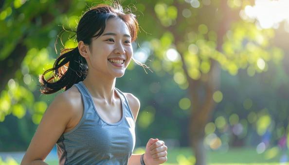ジョギングする女性 ジョギングする女性の写真