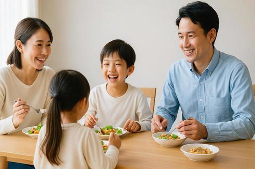 家族が食卓で笑顔の団らん・親子の時間 家族が食卓で笑顔の団らん・親子の時間の写真