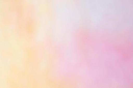 ピンクとオレンジの淡いグラデーション背景 背景,素材,ぼかしの写真素材