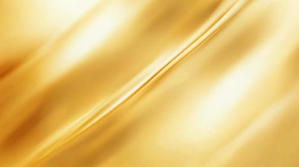 光沢ある金色の布地 光沢ある金色の布地の写真