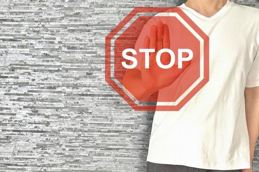 若い男性とSTOP ストップ,中止,注意の写真素材