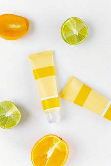 Fruit cross section and two yellow tubes, JPG