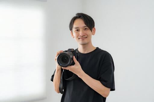 カメラマン 男性,大人,レンズの写真素材