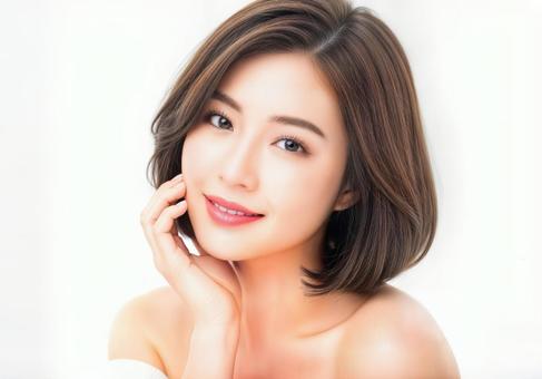 微笑む茶髪のボブヘアの若い女性の写真