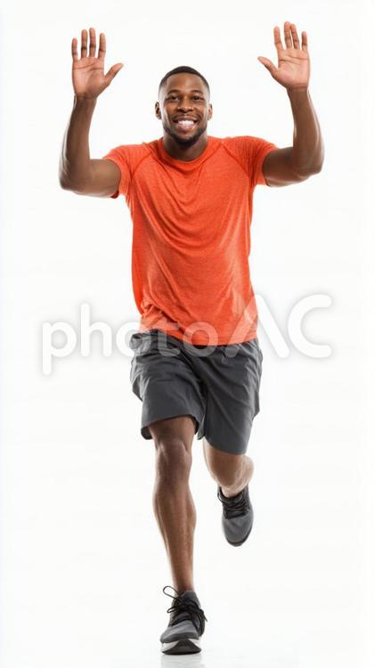 腕を上げて喜ぶ男性ランナー ランナー,男性,1人の写真素材