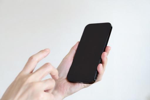 スマートフォンを使う手元 スマートフォンを使う手元 スマホ,スマートフォン,画面の写真素材