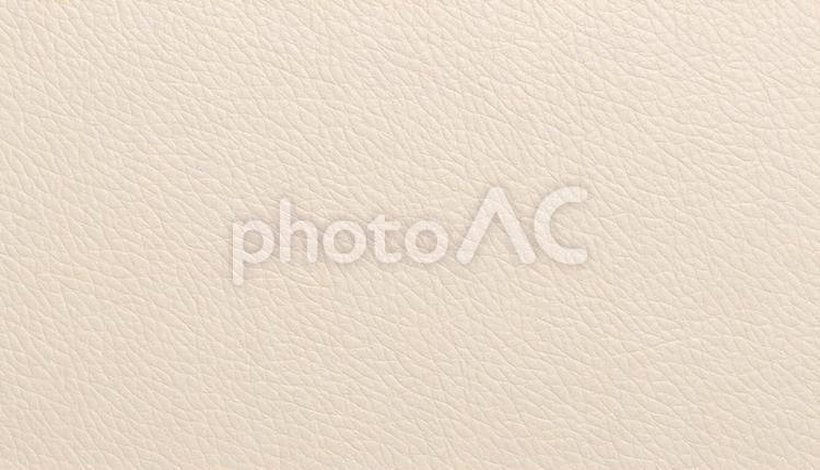 クリーム色のリアルな質感のレザーの背景 クリーム色,ぴかぴか,表面の写真素材