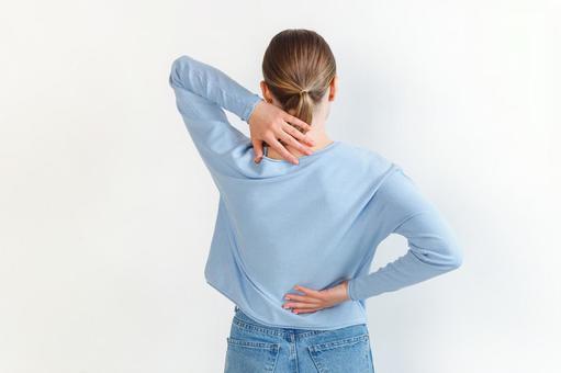 首の後ろと腰を押さえる女性 生理,月経,女性の写真素材