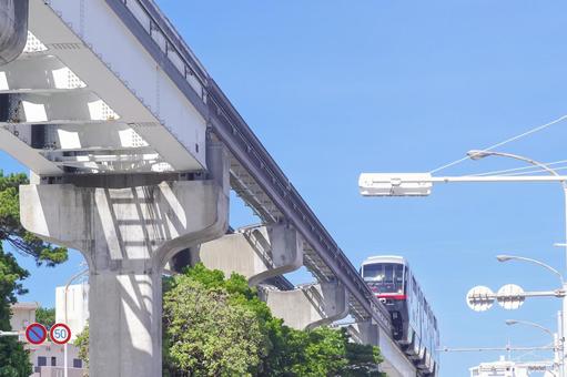 Okinawa Monorail train running under clear skies, JPG Okinawa Monorail train running under clear skies, JPG