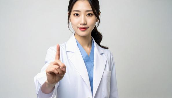 指をさす女医の写真