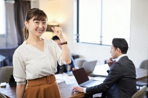 A woman doing a guts pose at a meeting, JPG A woman doing a guts pose at a meeting, female, employee, business casual, JPG