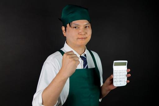 計算と仕事の達成感 計算と仕事の達成感 電卓,計算機,仕事の写真素材
