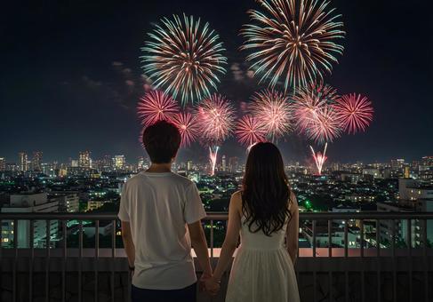 夏の花火を見つめる日本人カップル 夏の花火を見つめる日本人カップル の写真