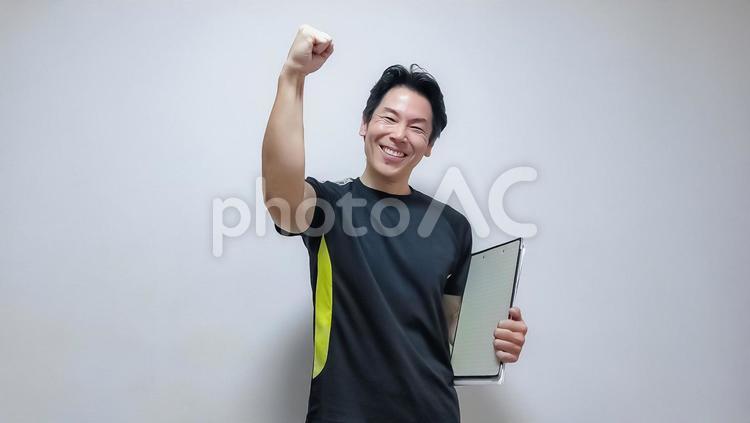 笑顔の中年スポーツトレーナー男性 男性,笑顔,スポーツの写真素材