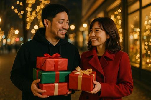 プレゼントを抱えたカップル プレゼントを抱えたカップルの写真