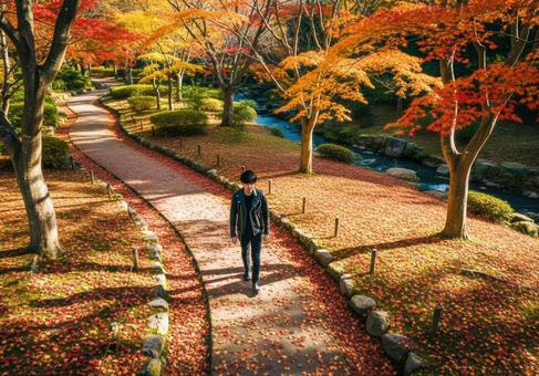 秋の庭園を散策する革ジャン姿の男性 秋の庭園を散策する革ジャン姿の男性の写真