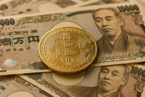 紙幣とビットコイン 紙幣とビットコインの写真