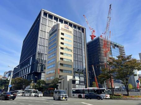 ワンフクオカビルディングと建設中のビル ワンフクオカビルディング,ワンビル,新福岡ビルの写真素材