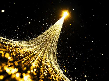 金色に輝く星の光跡の写真