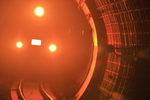 Headlights illuminating a railway tunnel, JPG Headlights illuminating a railway tunnel, JPG