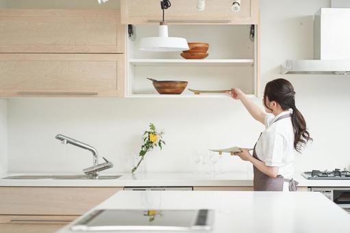 Asian woman organizing the kitchen, JPG Asian woman organizing the kitchen, housekeeping acting, kitchen, storage, JPG