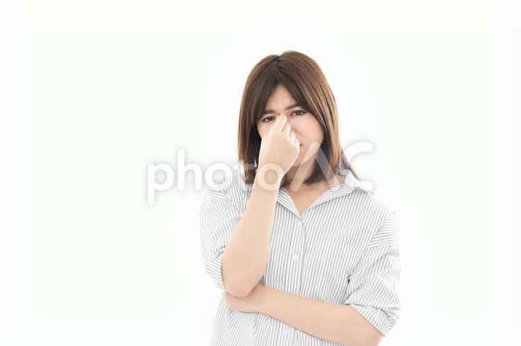 ネガティブイメージ　鼻炎　眼精疲労 女性,人物,ビジネスウーマンの写真素材
