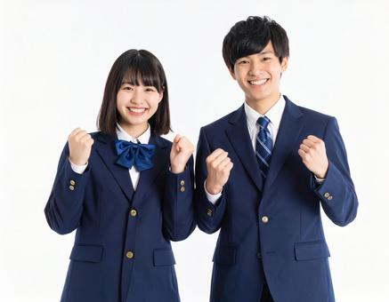 ガッツポーズでエールを送る男女高校生 ガッツポーズでエールを送る男女高校生の写真