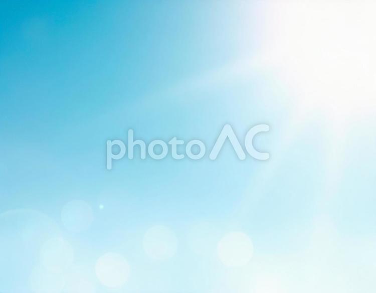 雲ひとつない青空の背景 青空,陽射し,レンズフレアの写真素材