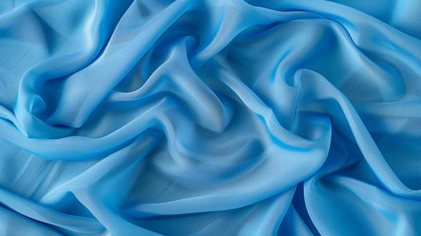 青い布のシワと光沢テクスチャ背景の写真