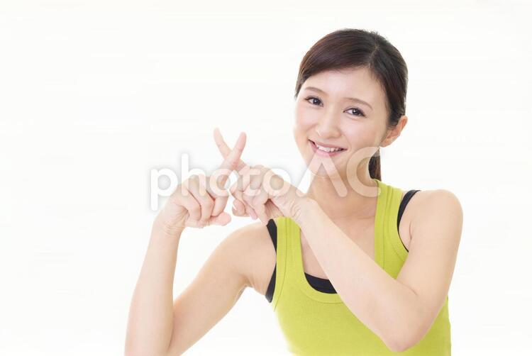 禁止の意思表示をする女性 女性,女,笑顔の写真素材