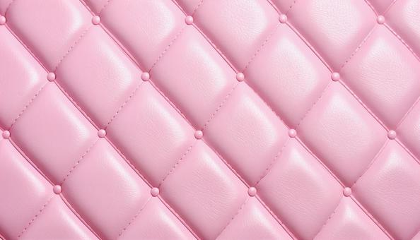 薄桃色のリアルな質感のレザーの背景の写真
