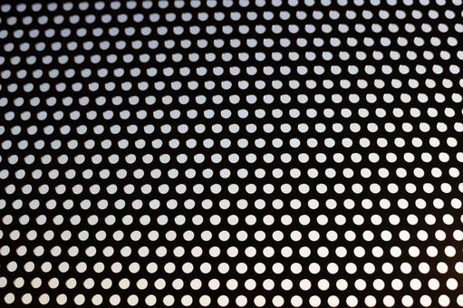 パンチングメタルの黒背景素材 パンチングメタル,テクスチャ,背景の写真素材