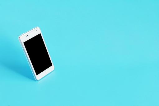 スマートフォンと青背景 スマートフォンと青背景 スマートフォン,携帯電話,デバイスの写真素材