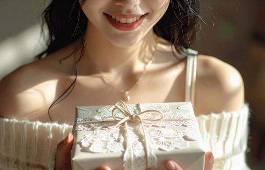 プレゼントと女性 プレゼントと女性の写真