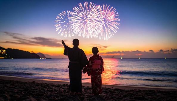打ち上げ花火を見る男女 打ち上げ花火を見る男女の写真